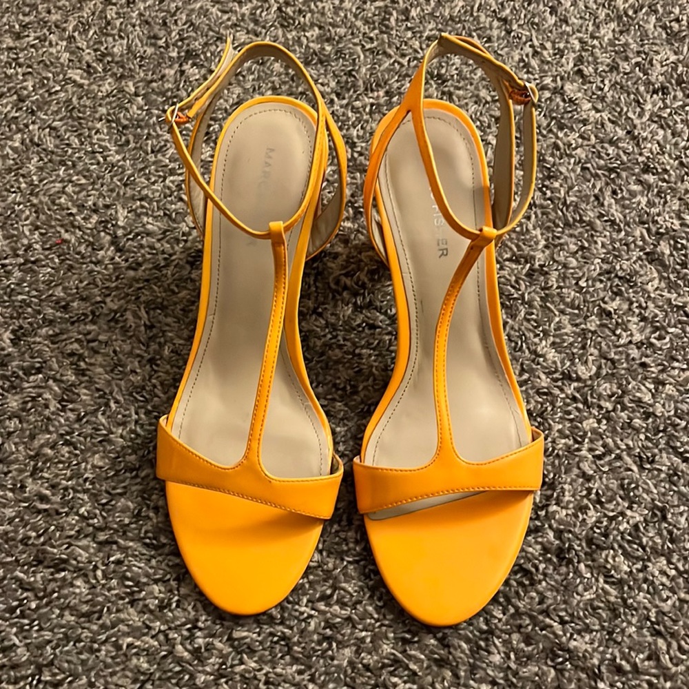 Neon orange patent shoes